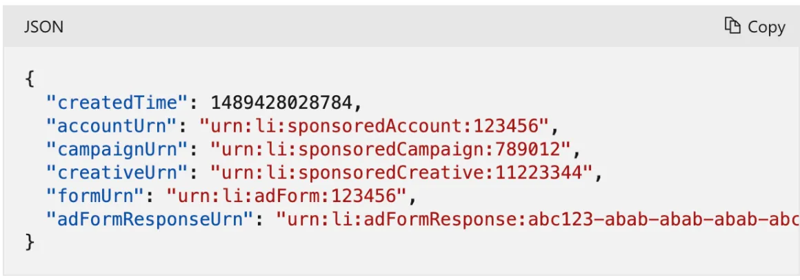 Example JSON lead notification payload with createdTime, accountUrn, campaignUrn, creativeUrn, formUrn, and adFormResponseUrn fields